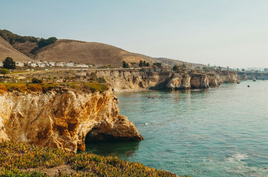Seaside resort coast with cliffs and calm blue sea