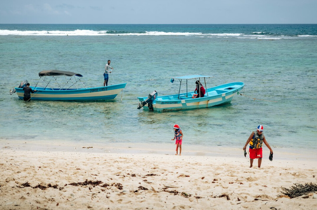 family on caribbean beach